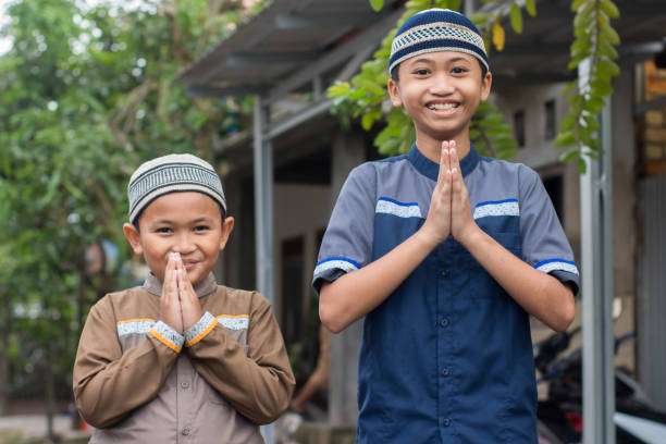 istock asian muslim boy Eid Mubarak greeting 1456343273
