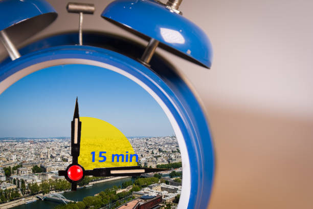 Ringing twin bell vintage classic alarm clock with the 15 minute city concept. 15-minute city concept inside a ringing twin bell vintage classic alarm clock. Selective Focus. A 15-minute city is a residential urban concept in which most daily necessities can be accomplished by either walking or cycling from residents' homes new urbanism stock pictures, royalty-free photos & images