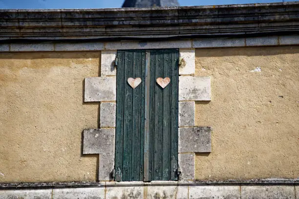 detail of an old brick wall with a heart, Issigeac - Dordogne