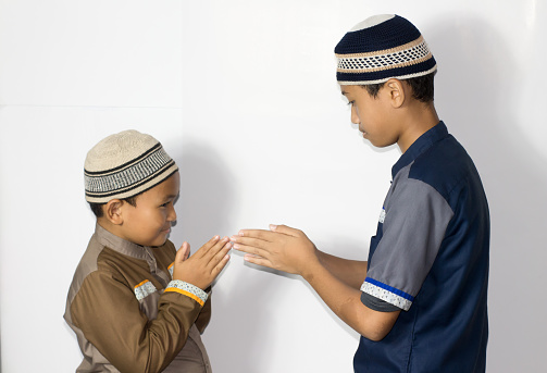 asian muslim boy Eid Mubarak greeting