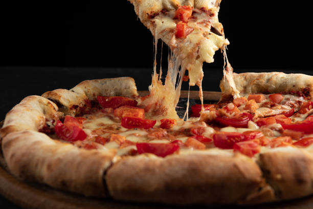 istock Neapalitan pizza with tomatoes on a white background. 1456350579