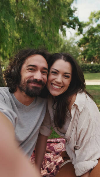 istock Couple in love making video call with mobile phone 1456352337