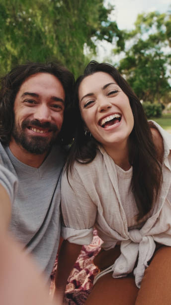 istock Couple in love making video call with mobile phone 1456352341