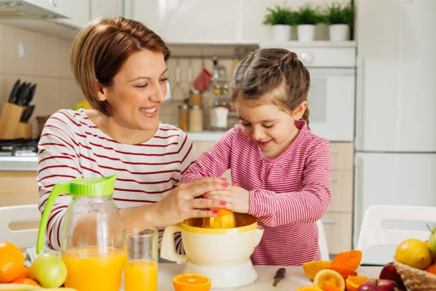 istock Family making fresh orange juice 1456352505