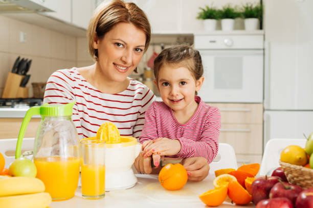 istock Family making fresh orange juice 1456352518