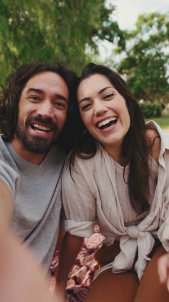 istock Couple in love making video call with mobile phone 1456352585