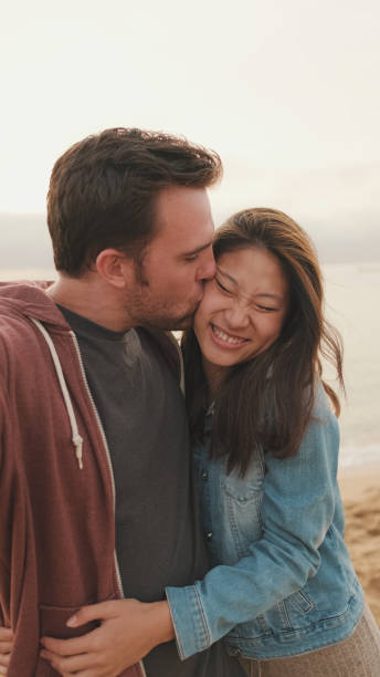 istock Laughing couple talking on video call 1456354106