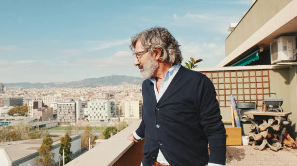 istock Senier enjoys the view standing on the balcony 1456355828