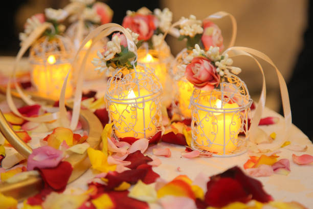 Beautiful composition with burning candles and flowers on table. wedding night
