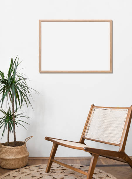 istock Artwork mockup in interior design. Blank picture frame on a wall. Horizontal orientation 1456359665