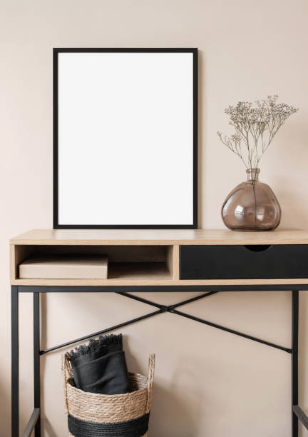 istock Artwork mockup in interior design. Blank picture frame on a wall. Vertical orientation 1456359666
