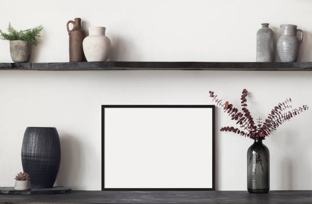 istock Artwork mockup in interior design. Blank picture frame on a wall. Horizontal orientation 1456359707