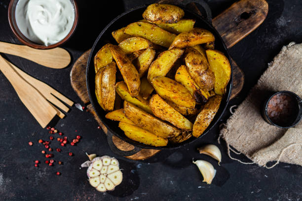 istock fried potatoes Rustic potato with garlic and spices 1456365175