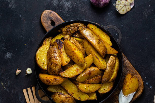 istock fried potatoes Rustic potato with garlic and spices 1456365201