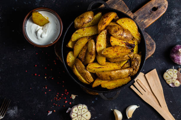 istock fried potatoes Rustic potato with garlic and spices 1456365214
