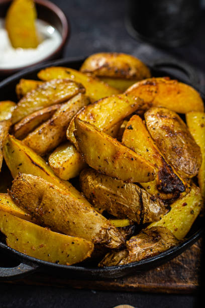 istock fried potatoes Rustic potato with garlic and spices 1456365228