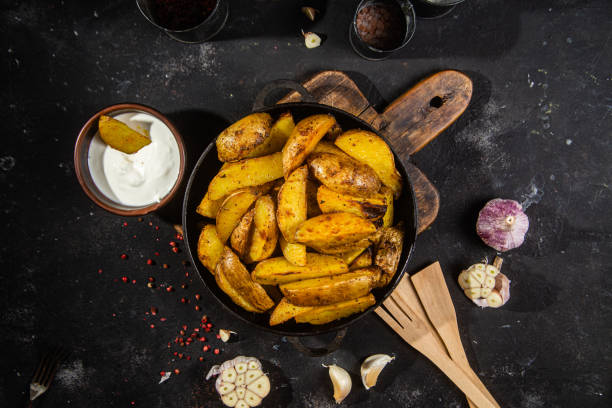 istock fried potatoes Rustic potato with garlic and spices 1456365244