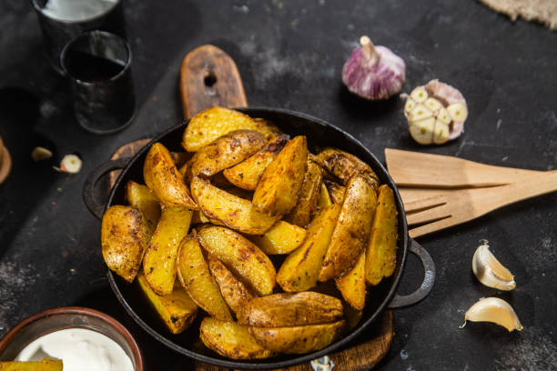 istock fried potatoes Rustic potato with garlic and spices 1456365253