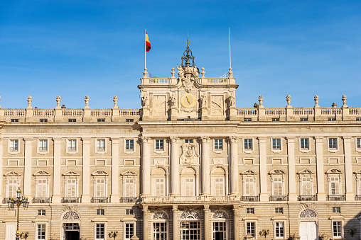 Madrid, Spain - Dec 10th, 2022: The main facade of the Madrid Royal Palace in Baroque style, in the past used as the residence of the King of Spain, Plaza de la Armeria, Community of Madrid, Spain, southern Europe.
