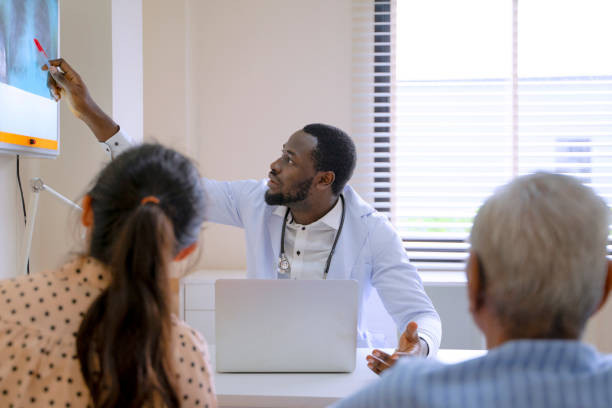 istock Doctor and patient at hospital. 1456367688