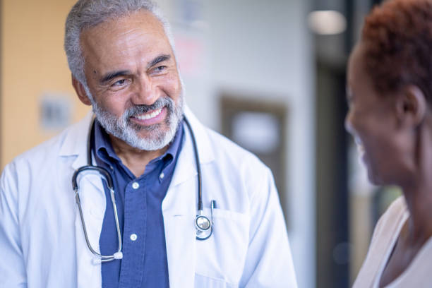 istock Patient and doctor discussing and smiling 1456372258
