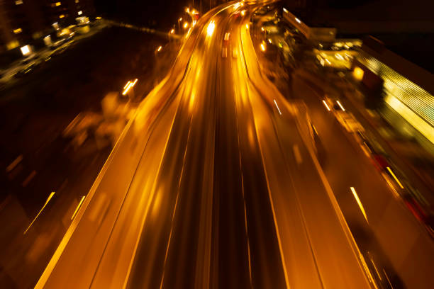 istock abstract blurred background of highway at night 1456373186