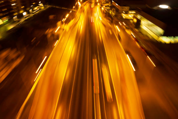istock abstract blurred background of highway at night 1456373191