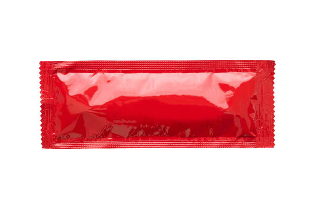 Blank red foil tomato ketchup sauce sachet package isolated on white background