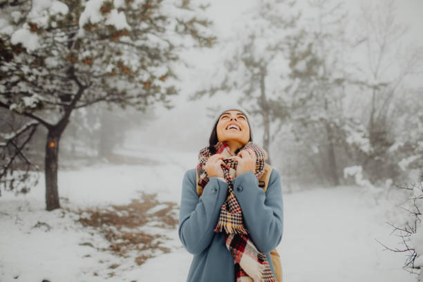 istock Joyful young woman enjoys a cold winter day 1456374412
