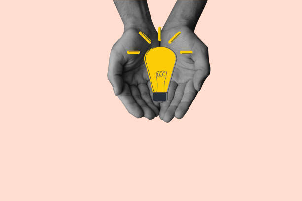 istock Two hands holding the light bulb symbolizing new idea development. Concept of creativity, retro design, business, idea making. 1456377396