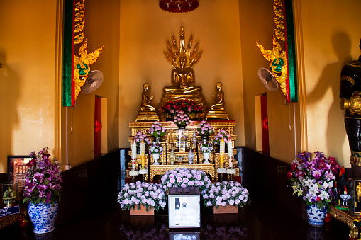 Ancient buddha statue in antique ubosot ordination hall for thai people travel visit respect praying blessing wish mystery in Wat Toom pagoda or Tum temple on December 30, 2022 in Ayutthaya, Thailand