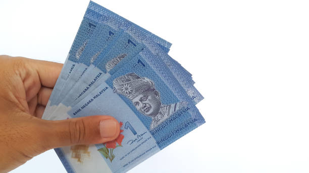istock Hand holding Malaysian Ringgit money on white background 1456378679