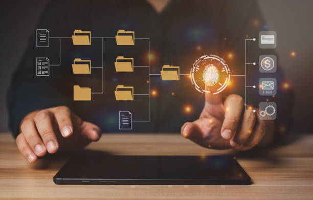 istock Businessman working on virtual screen of Document Management System (DMS). Software for archiving, searching, and managing corporate files and information, documentation in enterprise with ERP. 1456382100
