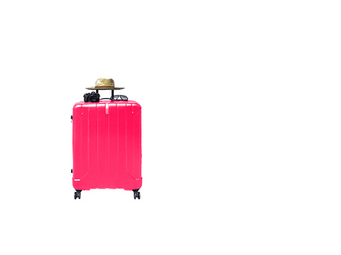 Isolated and clipping path picture. Suitcase (pink), sunglasses, camera and straw hat. Travel and vacation theme. Relaxation. white background and copy space.