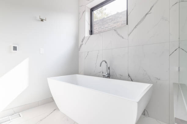 istock A standalone tub with marble floor and wall. 1456385296