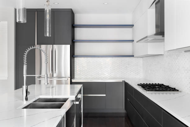 istock A modern kitchen with grey and white cabinets and white marble countertops. 1456385337