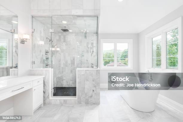 A Luxury Bathroom With A Walkin Tiled Shower And Standalone Tub Stock Photo - Download Image Now