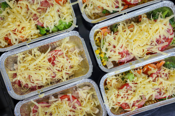 istock Raw chicken breast with vegetables and cheese in baking tray ready for oven 1456386463