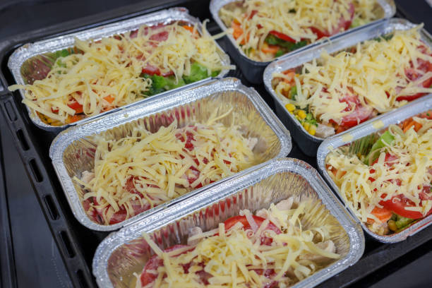 istock Raw chicken breast with vegetables and cheese in baking tray ready for oven 1456386471