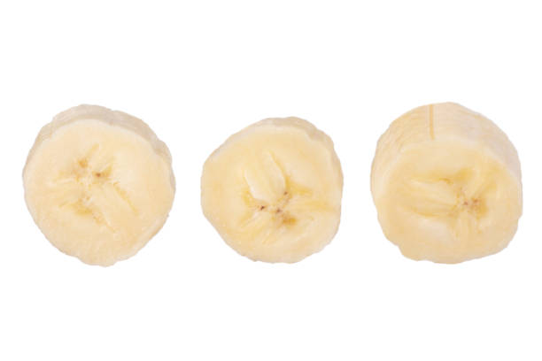 istock Fresh raw banana cut into pieces. Isolated on white background. 1456386875