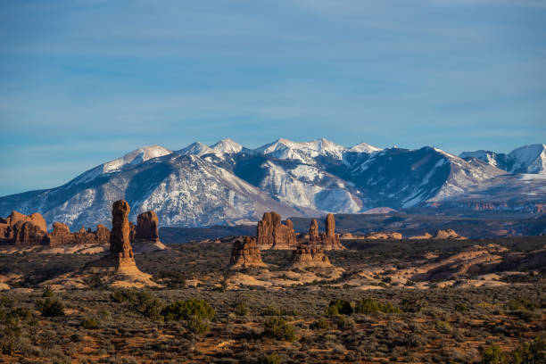 istock Rock formations with distant snow-covered mountains in the distance 1456387725