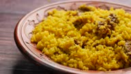 istock boiled yellow rice with meats on a plate 1456389506