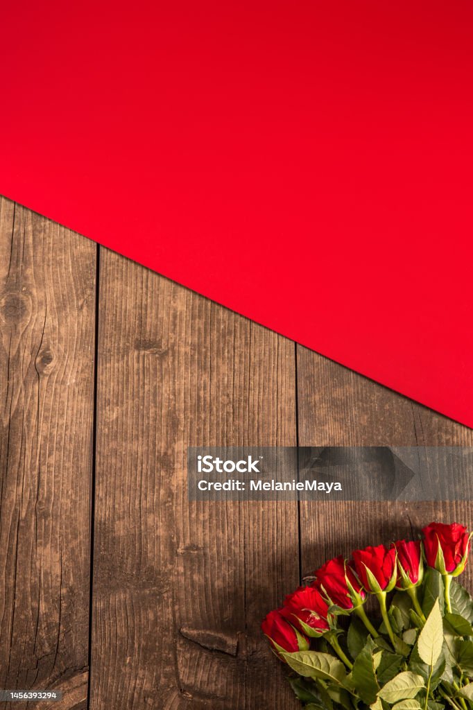Rustic wood background with red roses for Valentine’s Day Valentine Card Stock Photo