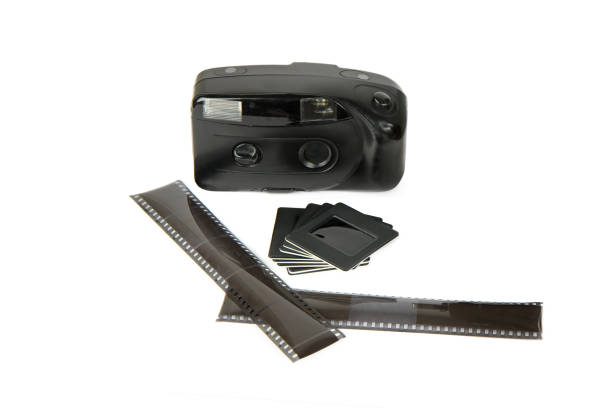 istock Old camera, film and slides isolated on white. 1456396658