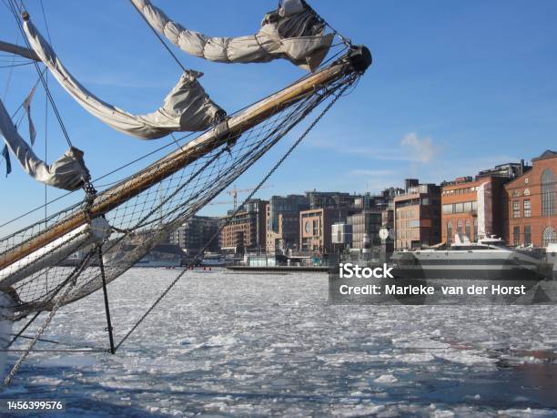 Aker Brygge In Oslo With A Sailing Ship Lying In The Oslofjord With Ice Floes Norway Stock Photo - Download Image Now