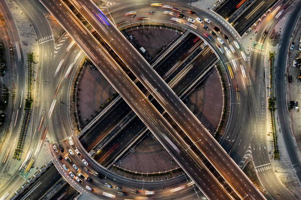istock Expressway top view, Road traffic an important infrastructure, Drone aerial view fly in circle, traffic transportation, Public transport or commuter city life concept of economic and energ, transport. 1456399873