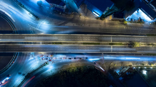 istock Expressway top view, Road traffic an important infrastructure, Drone aerial view fly in circle, traffic transportation, Public transport or commuter city life concept of economic and energ, transport. 1456399875