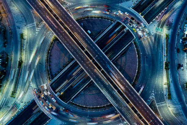 istock Expressway top view, Road traffic an important infrastructure, Drone aerial view fly in circle, traffic transportation, Public transport or commuter city life concept of economic and energ, transport. 1456399876