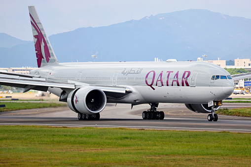 A Boeing 777 aircraft operated by Qatar Airways lands in Guangzhou Baiyun airport