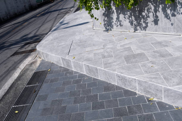 istock Gray stone texture Landscape floor tiles and drainage gutter, concept background image for outdoor hardscape, Step level of floor area for walk way and road 1456400847